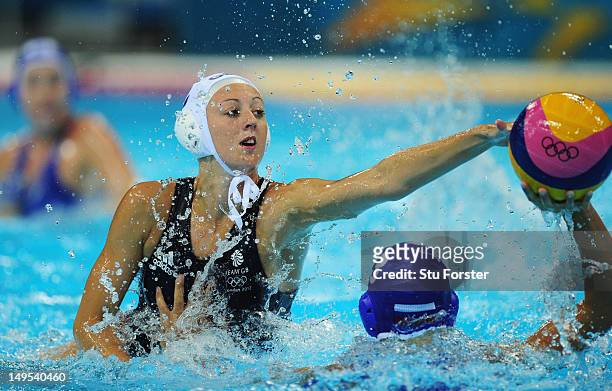 Beckie Kershaw of Great Britain challenges Ekaterina Prokofyeva of Russia during the Women's Water Polo Preliminary match between Great Britain and...