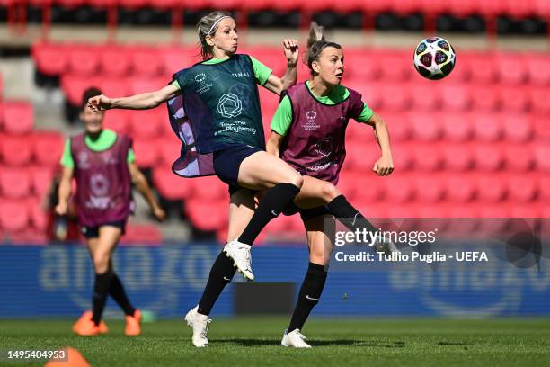 Kathrin Hendrich of VfL Wolfsburg battles for possession with Lena Lattwein of VfL Wolfsburg during a training session prior to the UEFA Women's...