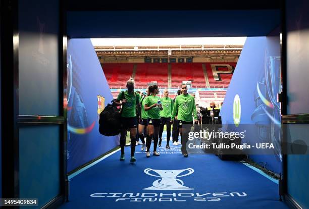 Joelle Wedemeyer, Lisa Weiss and team mates of VfL Wolfsburg leave the pitch during a training session prior to the UEFA Women's Champions League...