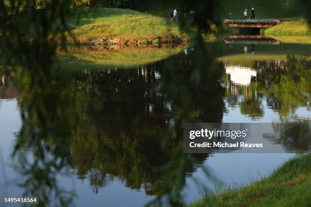 David Lingmerth and Alex Noren of Sweden cross a bridge on the tenth hole during the second round of the Memorial Tournament presented by Workday at...