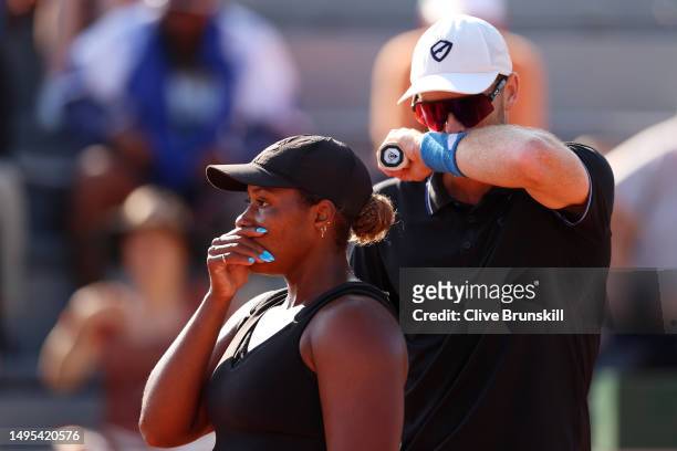 Taylor Townsend of United States speaks with partner Jamie Murray of Great Britain against Desirae Krawczyk of United States and Joe Salisbury of...