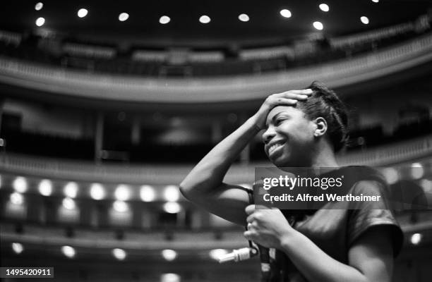 View of American Jazz & Blues musician and Civil Rights activist Nina Simone during an onstage rehearsal at Carnegie Hall, New York, New York, 1964.