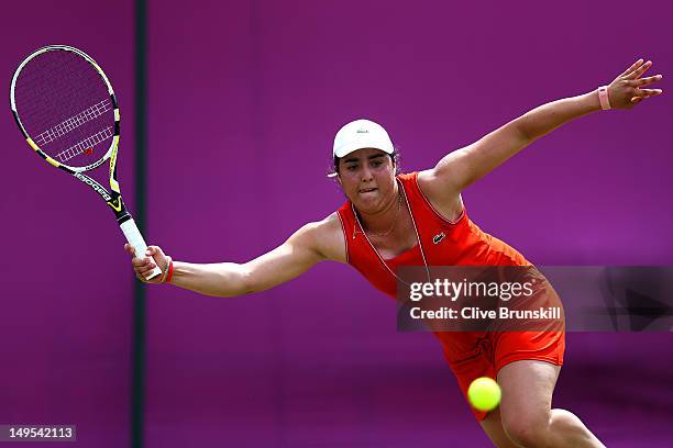 Ons Jabeur of Tunisia competes during her Women's Singles Tennis second round match against Sabine Lisicki of Germany on Day 3 of the London 2012...