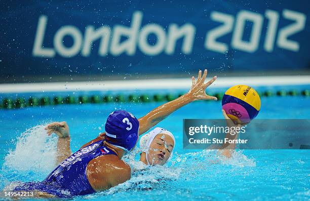 Francesca Painter-Snell of Great Britain is challenged Ekaterina Prokofyeva of Russia during the Women's Water Polo Preliminary match between Great...