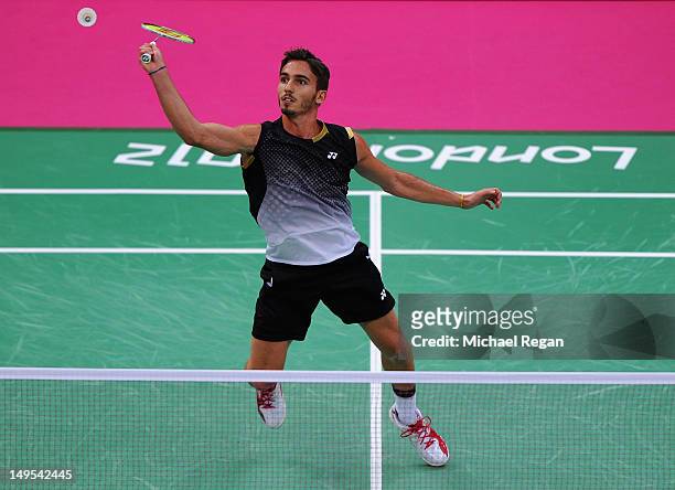 Pedro Martins of Portugal returns a shot against Peter Gade of Denmark during their Mens Singles Badminton on Day 3 of the London 2012 Olympic Games...