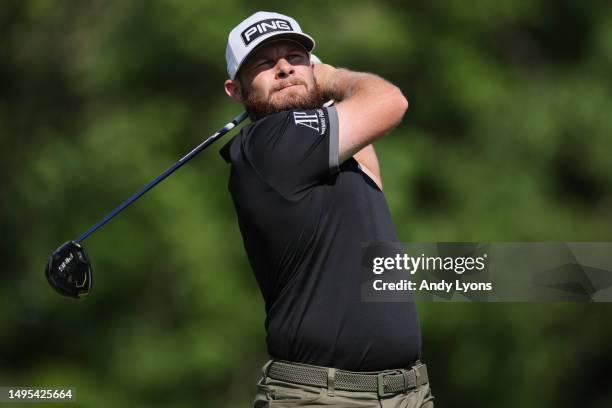Tyrrell Hatton of England plays his shot from the 18th tee during the second round of the Memorial Tournament presented by Workday at Muirfield...