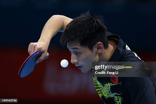Zhang Jike of China eyes the ball during his Men's Singles Table Tennis fourth round match against Vladimir Samsonov of Belarus on Day 3 of the...