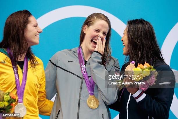 Silver medalist Emily Seebohm of Australia, gold medalist Missy Franklin of the UNited States and bronze medalist Aya Terakawa of Japan celebrate...