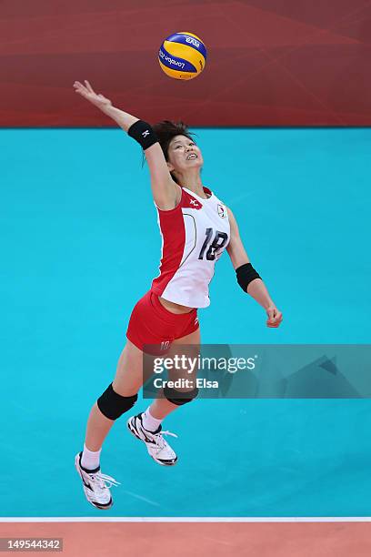 Saori Kimura of Japan spikes the ball in the Women's Volleyball Preliminary match between Italy and Japan on Day 3 of the London 2012 Olympic Games...