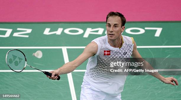 Denmark's Peter Gade returns a shot to Pedro Martins of Portugal during their men's singles badminton match at the London 2012 Olympic Games in...