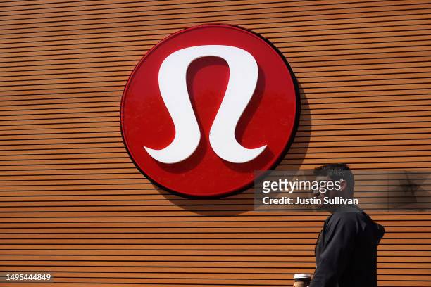 Pedestrian walks by a sign posted in front of a LuLulemon store on June 02, 2023 in Corte Madera, California. Shares of LuLulemon stock surged Friday...