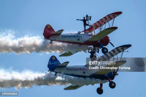Wingwalkers from the AeroSuperBatics display team entertain the crowds on the first day of the Midlands Air Festival on June 02, 2023 in Alcester,...