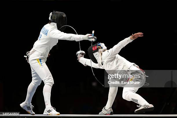 Britta Heidemann of Germany competes against Yana Shemyakina of Ukraine during the Gold medal bout in the Women's Epee Individual Fencing Finals on...