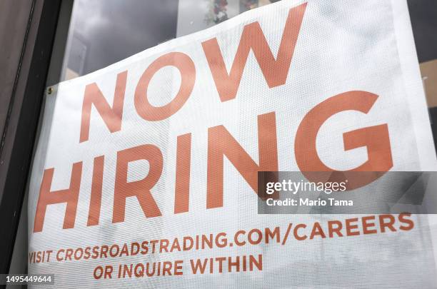 Now Hiring' sign is displayed outside a resale clothing shop on June 2, 2023 in Los Angeles, California. Today’s U.S. Labor report shows that...