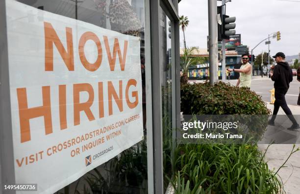 Now Hiring' sign is displayed outside a resale clothing shop on June 2, 2023 in Los Angeles, California. Today’s U.S. Labor report shows that...