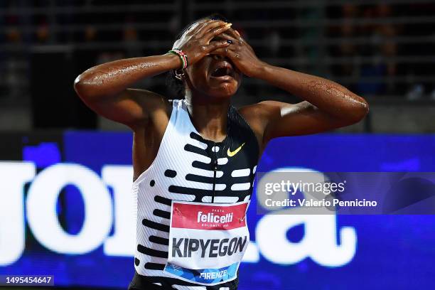 Faith Kipyegon of Team Kenya celebrates victory in the Women's 1500m during the Golden Gala Pietro Mennea, part of the Diamond League series at...