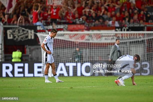 Theo Corbeanu and Fabian Klos of Bielefeld look dejected during the Second Bundesliga playoffs first leg match between SV Wehen Wiesbaden and DSC...