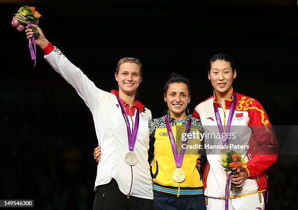 Silver medal winner Britta Heidemann of Germany, Gold medal winner Yana Shemyakina of Ukraine and Bronze medal winner Yujie Sun of China poses after...