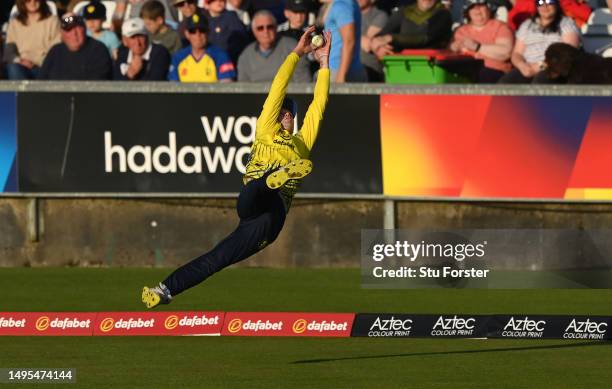 Durham substitute fielder Jonathan Bushnell dives to catch out Lancashire batsman Luke Wood during the Vitality Blast T20 match between Durham...