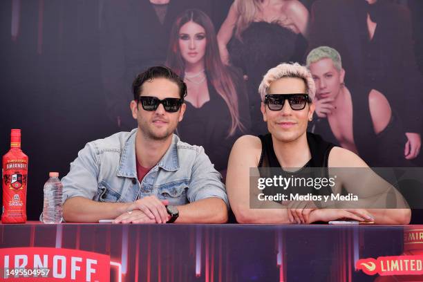 Christopher Uckermann and Christian Chávez of group RBD pose for a photo during an event to sign autographs to Vodka Smirnoff bottles at Walmart...