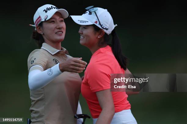 Chella Choi of South Korea hugs Rose Zhang of the United States on the ninth green during the second round of the Mizuho Americas Open at Liberty...