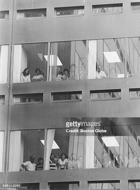 People in the Blue Cross Building looking at the scene of the shooting murders of five men in the Blackfriars Club basement.