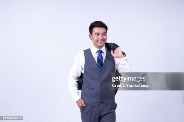 portrait of a confident  asian successful businessman against white background - pudong stock pictures, royalty-free photos & images