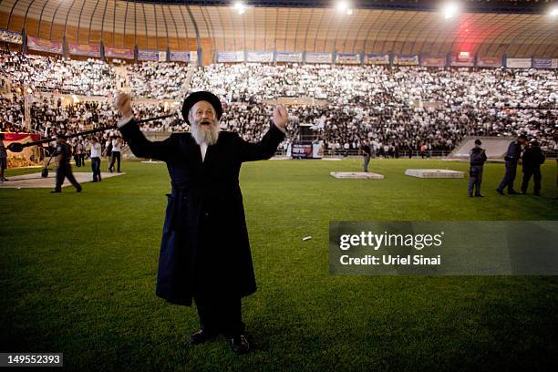 Man dances as tens of thousands of Ultra Orthodox Jews attend Siyum HaShas, a celebration marking completion of a seven-and a half year daily...