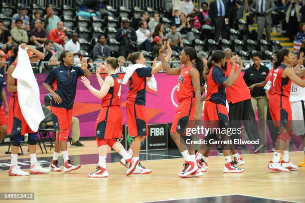 Asjha Jones and Diana Taurasi high five against Angola at the Olympic Park Basketball Arena during the London Olympic Games on July 30, 2012 in...