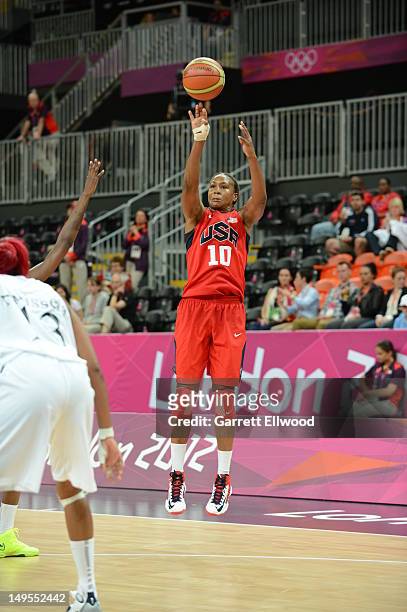 Tamika Catchings of the United States shoots against Angola at the Olympic Park Basketball Arena during the London Olympic Games on July 30, 2012 in...
