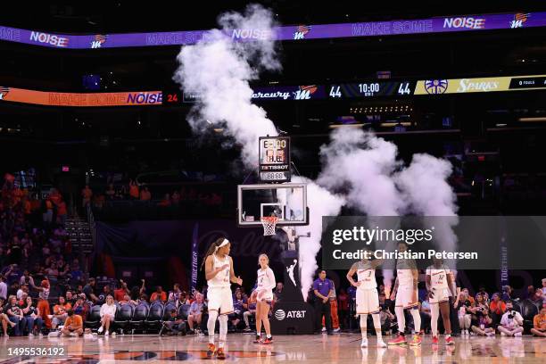 Moriah Jefferson, Sophie Cunningham, Diana Taurasi, Brittney Griner and Michaela Onyenwere of the Phoenix Mercury stand on the court during the...