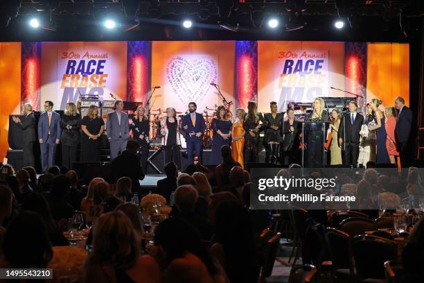 Race to Erase MS Founder Nancy Davis poses onstage with supporters during the 30th Annual Race To Erase MS Gala at Fairmont Century Plaza on June 02,...