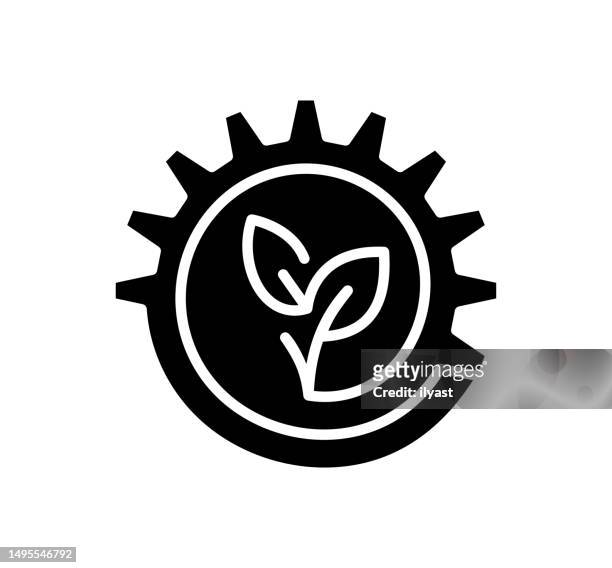 gearing towards sustainability black filled vector icon - engineer gearwheel factory stock illustrations