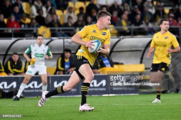Jordie Barrett of the Hurricanes run with the ball during the round 15 Super Rugby Pacific match between Hurricanes and Crusaders at Sky Stadium, on...