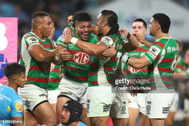 Hame Sele of the Rabbitohs celebrates a try with team mates during the round 14 NRL match between Gold Coast Titans and South Sydney Rabbitohs at...