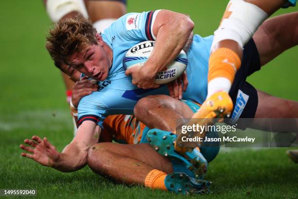 Michael Hooper of the Waratahs is tackled during the round 15 Super Rugby Pacific match between NSW Waratahs and Moana Pasifika at Allianz Stadium on...