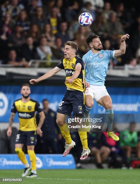 Matthew Leckie of Melbourne City and Maximilien Balard of the Mariners compete for the ball during the 2023 A-League Men's Grand Final match between...