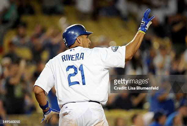 Juan Rivera of the Los Angeles Dodgers scores in the sixth inning against the Arizona Diamondbacks at Dodger Stadium on July 30, 2012 in Los Angeles,...