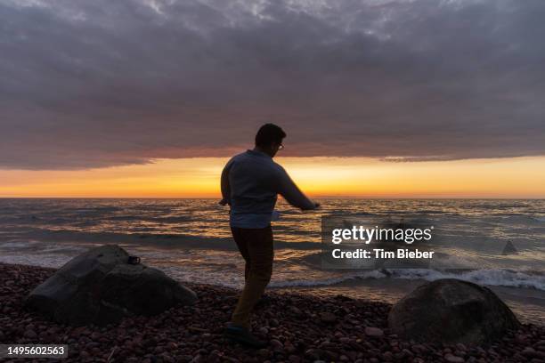 Skip Rocls Skipping Rocks At Lake Photos and Premium High Res Pictures - Getty Images