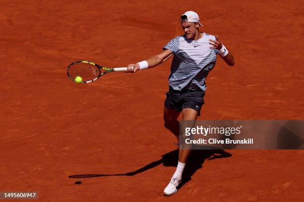 Holger Rune of Denmark plays a forehand against Genaro Alberto Olivieri of Argentina during the Men's Singles Third Round Match on Day Seven of the...