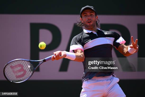 Borna Coric of Croatia plays a forehand against Tomas Martin Etcheverry of Argentina during the Men's Singles Third Round Match on Day Seven of the...