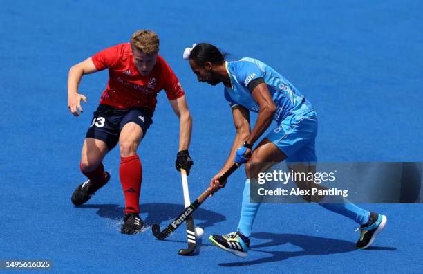 Singh Hardik of India is tackled by Timothy Nurse of Great Britain during the FIH Hockey Pro League Men's match between Great Britain and India at...