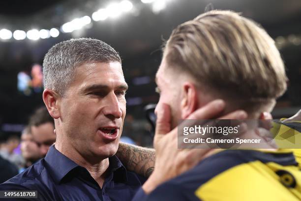 Mariners head coach Nick Montgomery celebrates with Jason Cummings of the Mariners after winning the 2023 A-League Men's Grand Final match between...
