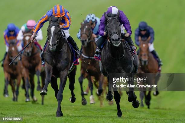 Ryan Moore riding Auguste Rodin win The Betfred Derby from Rossa Ryan and King Of Steel on Derby Day at Epsom Racecourse on June 03, 2023 in Epsom,...