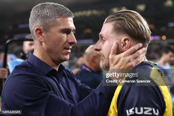 Mariners head coach Nick Montgomery celebrates with Jason Cummings of the Mariners after winning the 2023 A-League Men's Grand Final match between...