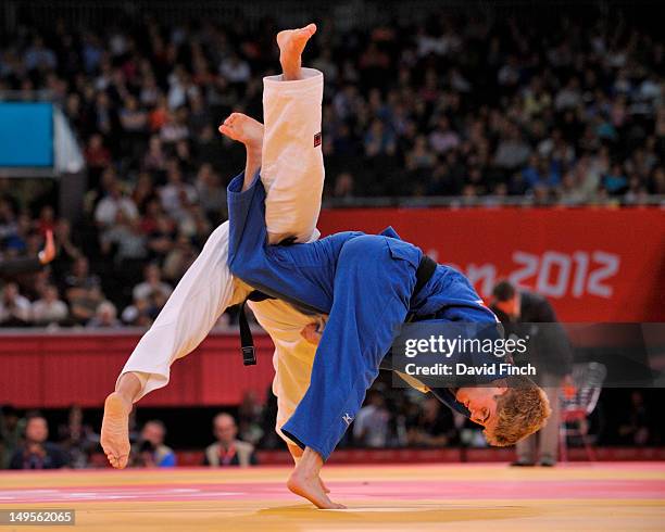 Nicolas Delpopolo of United States competes on his way to defeating Dirk Van Tichelt of Belgium to reach the quarterf-inals in the Men's -73kg Judo...