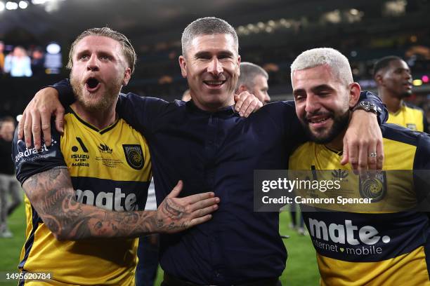 Mariners head coach Nick Montgomery celebrates with Jason Cummings and Christian Theoharous of the Mariners after winning the 2023 A-League Men's...