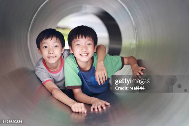 little boy on tunnel - 12 year old cute boys stock pictures, royalty-free photos & images