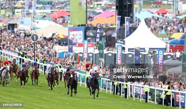 Auguste Rodin ridden by Ryan Moore wins The Betfred Derby during Derby Day at Epsom Downs Racecourse on June 03, 2023 in Epsom, England.