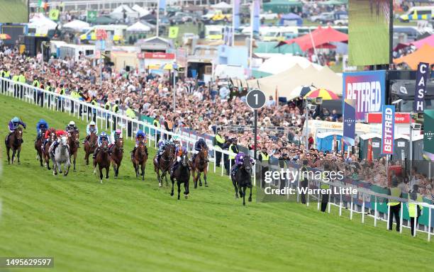 Auguste Rodin ridden by Ryan Moore wins The Betfred Derby during Derby Day at Epsom Downs Racecourse on June 03, 2023 in Epsom, England.